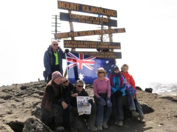 Photograph of people at summit of Mt Kilimanjaro